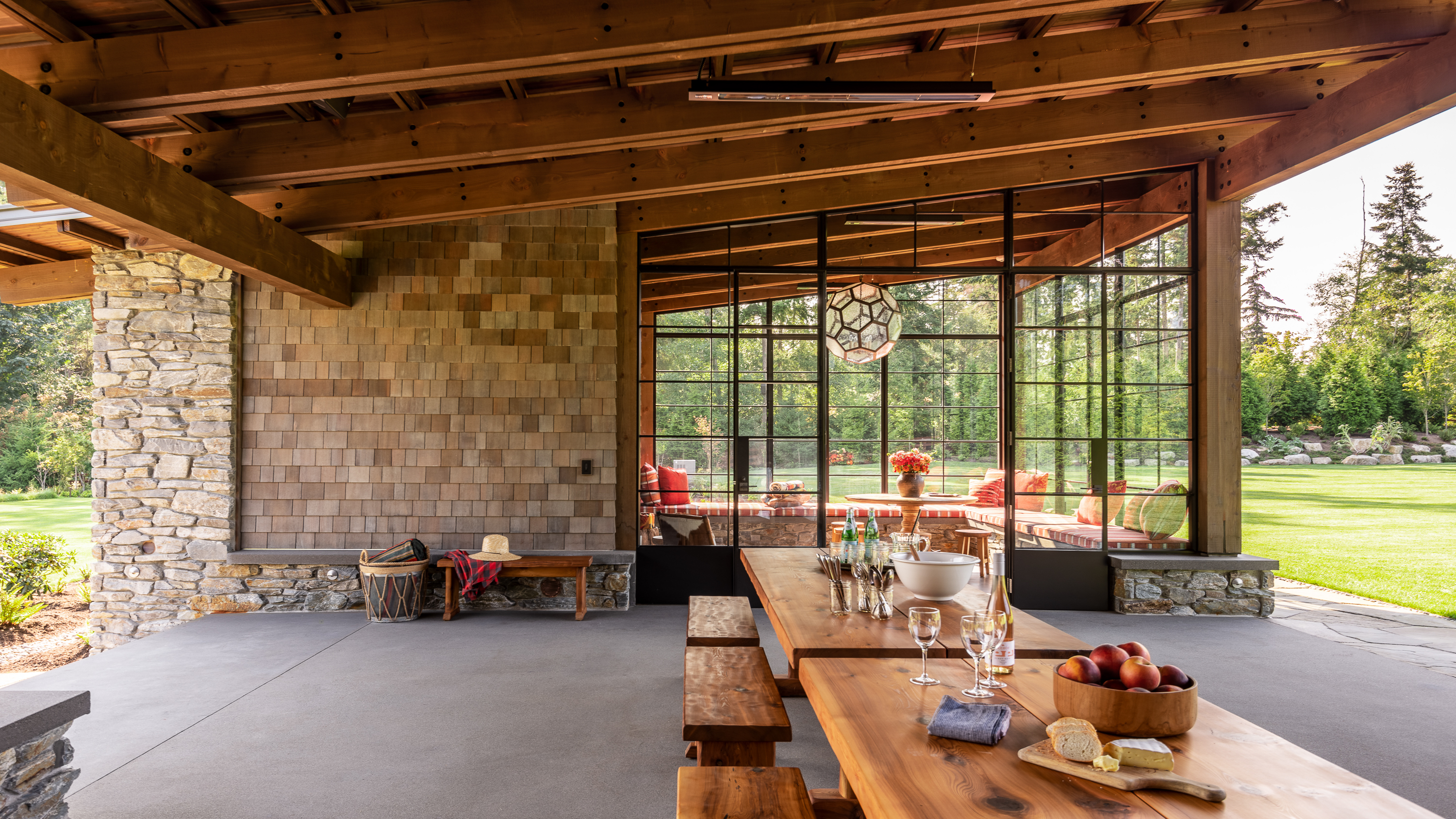Materials are a hardy, outdoor spec—concrete floors, stone from nearby Vancouver Island, Doug fir from the Pacific Northwest, Western red cedar shingles and clear cedar paneling—all topped by a durable standing seam metal roof.