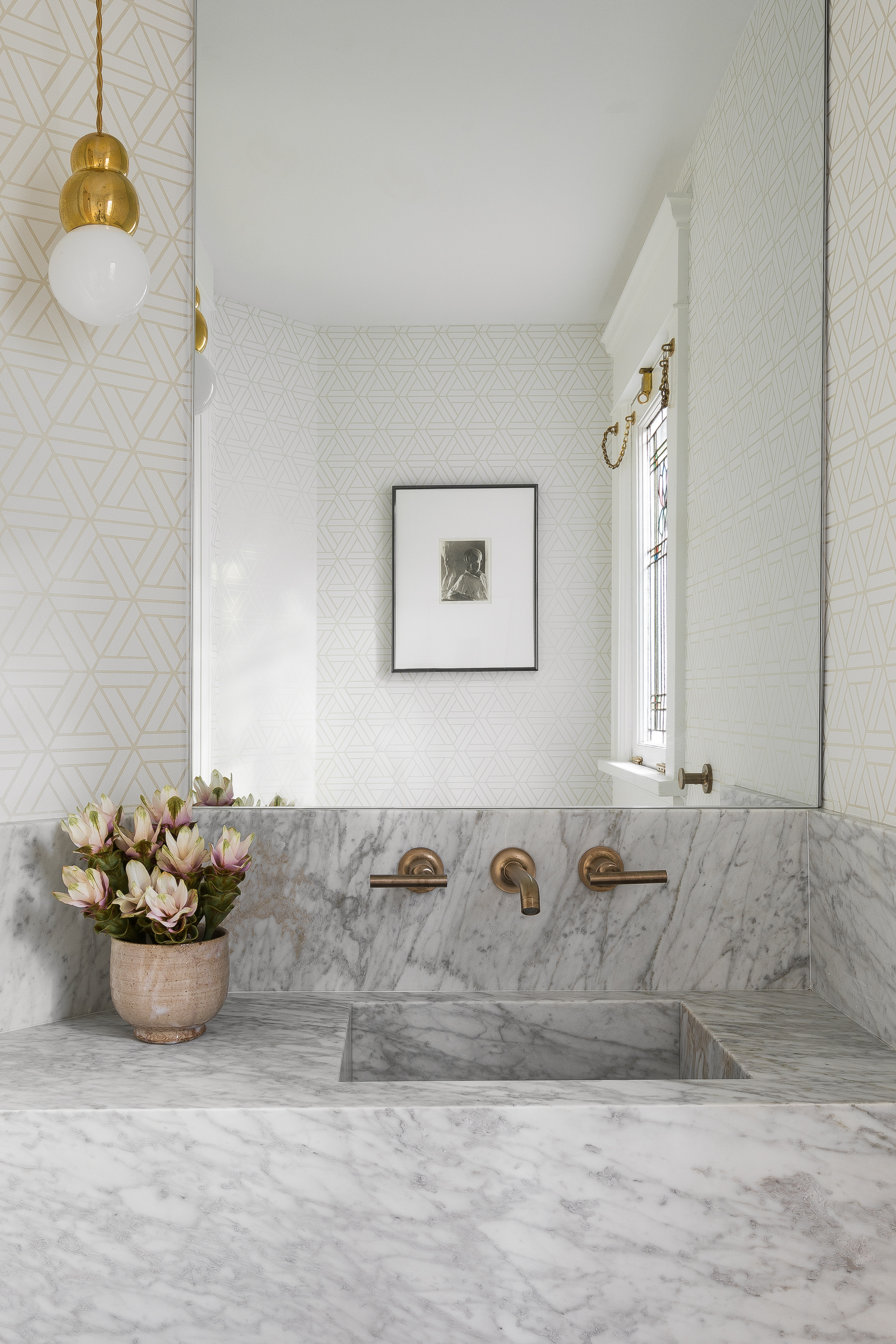 A new integrated-marble powder room was added to the entry.