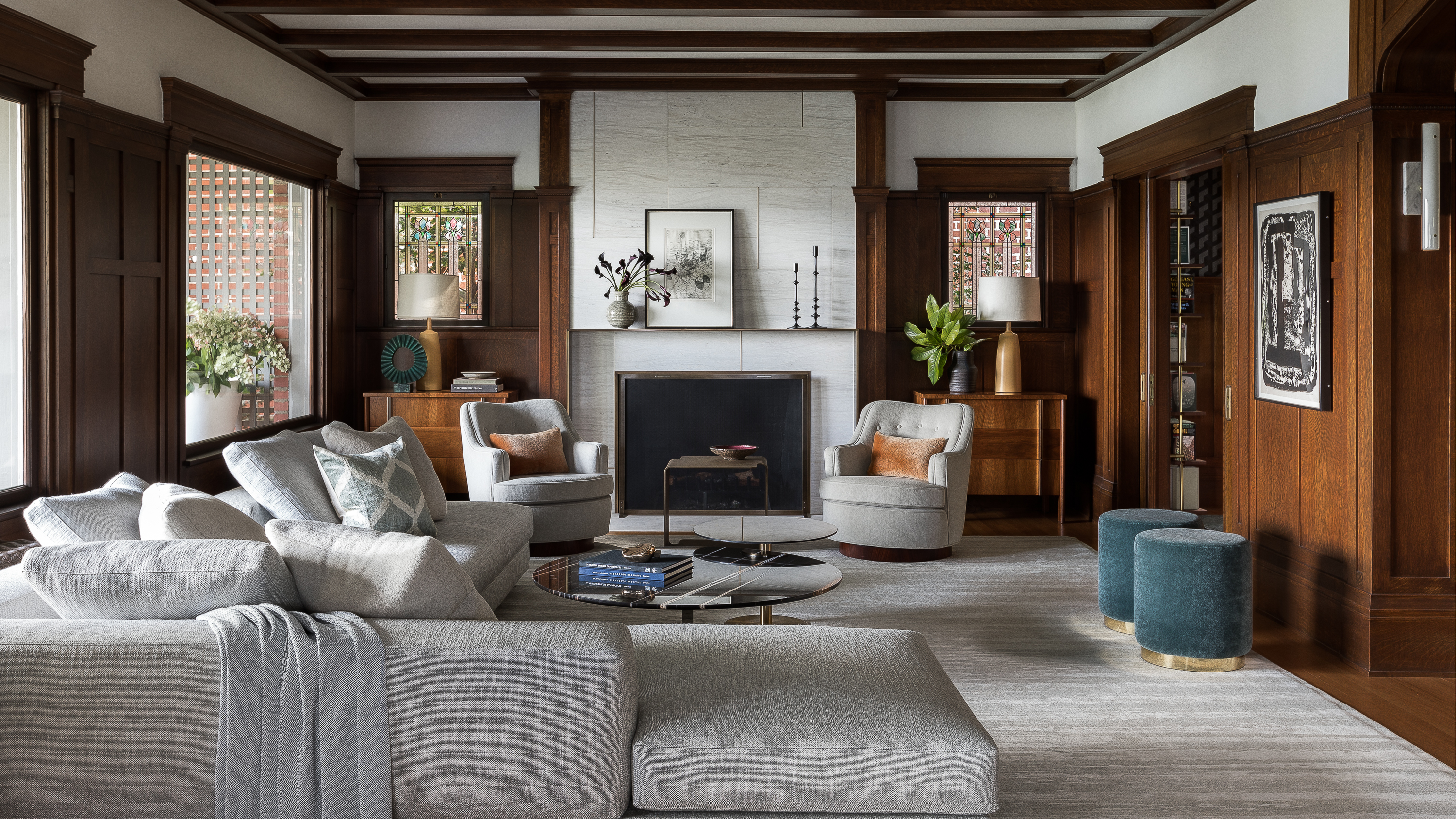 The living room showcases a custom Minotti sectional, marble coffee table, Mohair-covered Edward Wormley chairs, and custom metal cube table.
