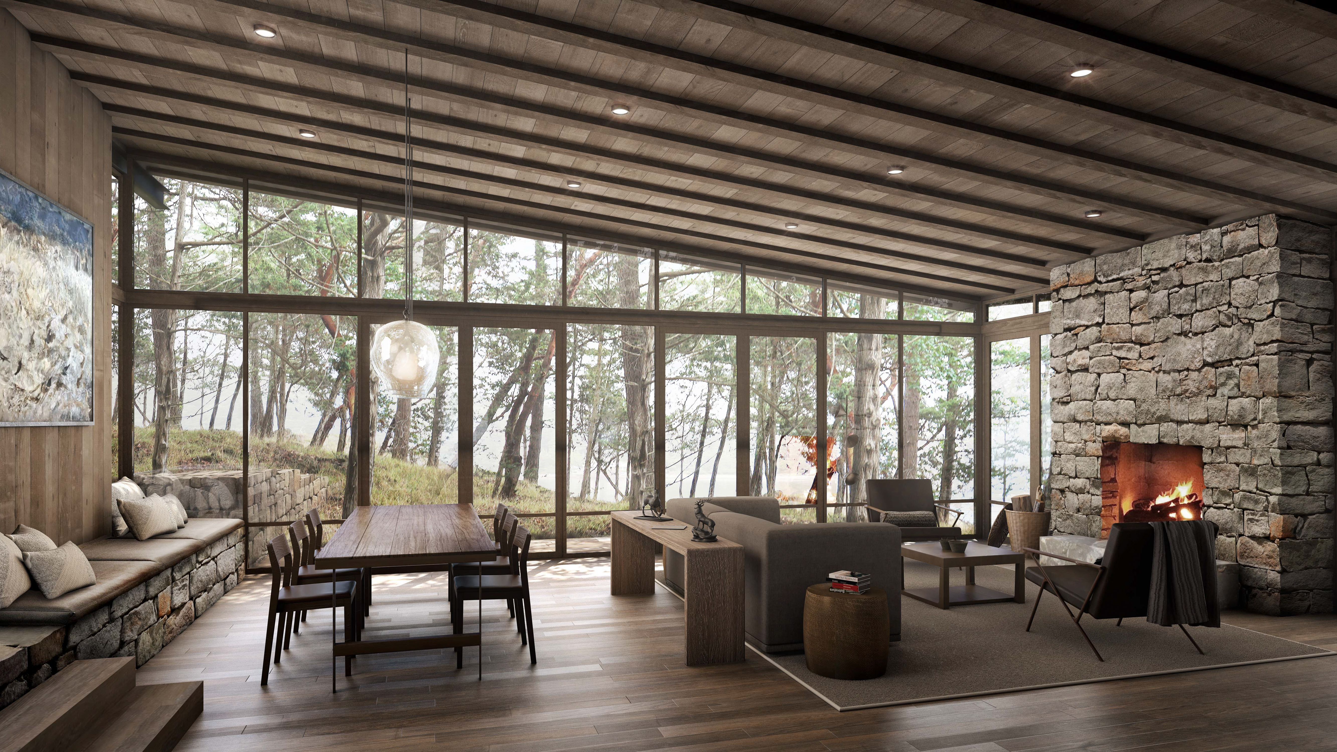 Open floor plan dining and living room with glass walls, offering panoramic views of the surrounding timber and natural landscape.