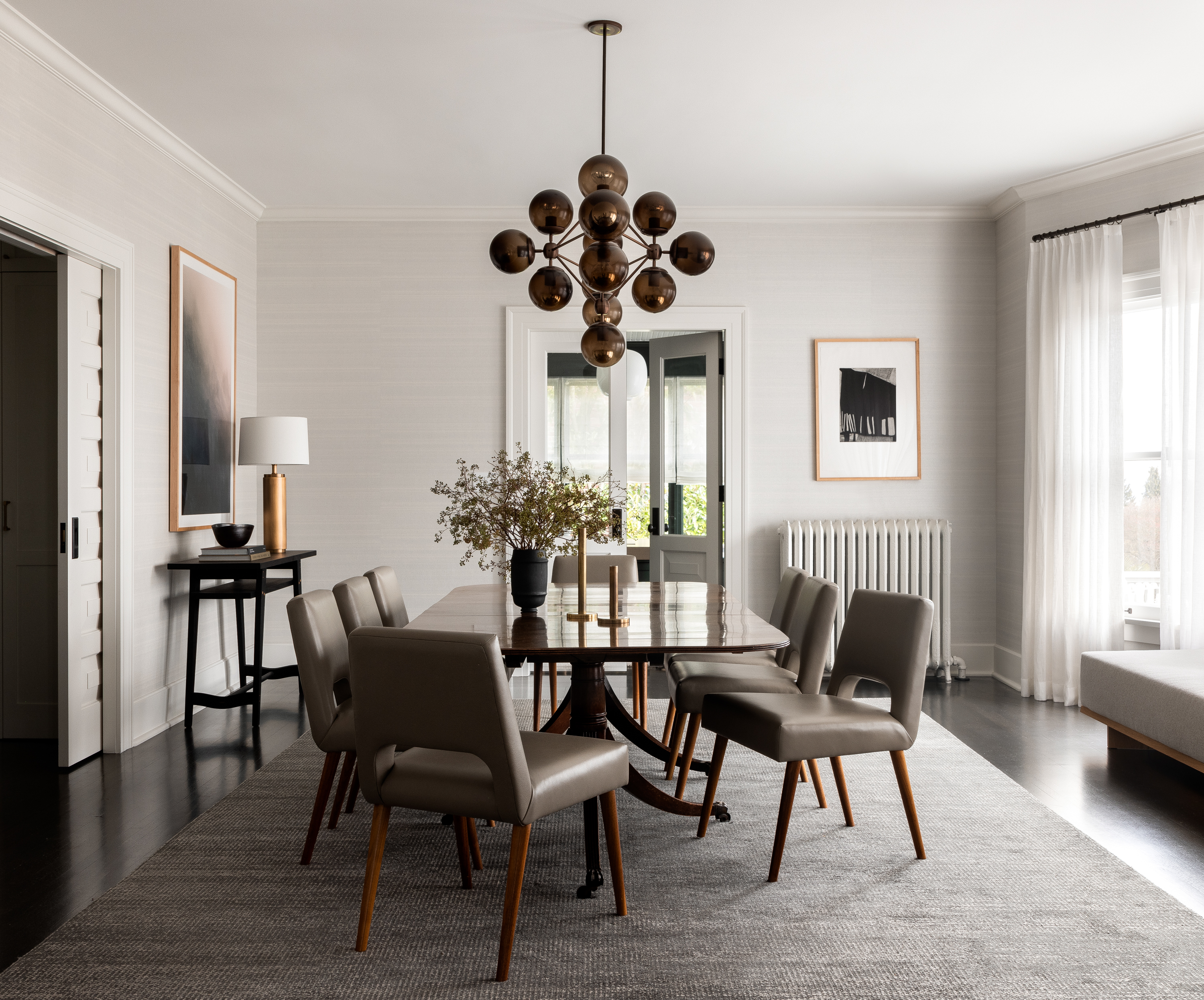 A serene dining room with a white and smokey gray color scheme, creating an elegant and tranquil ambiance.